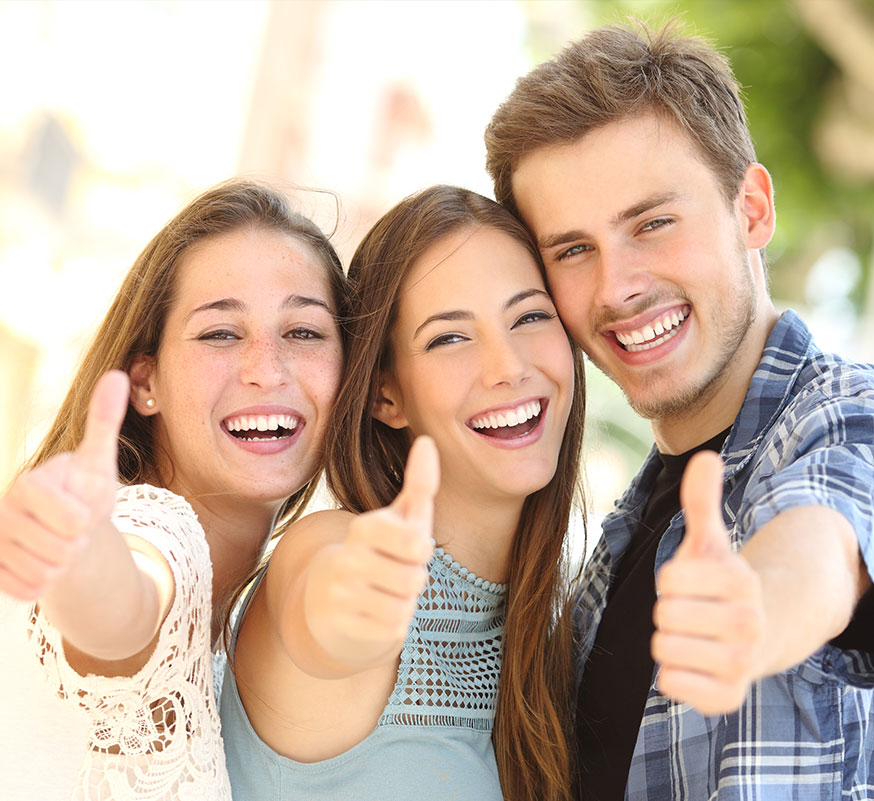 three young people smiling