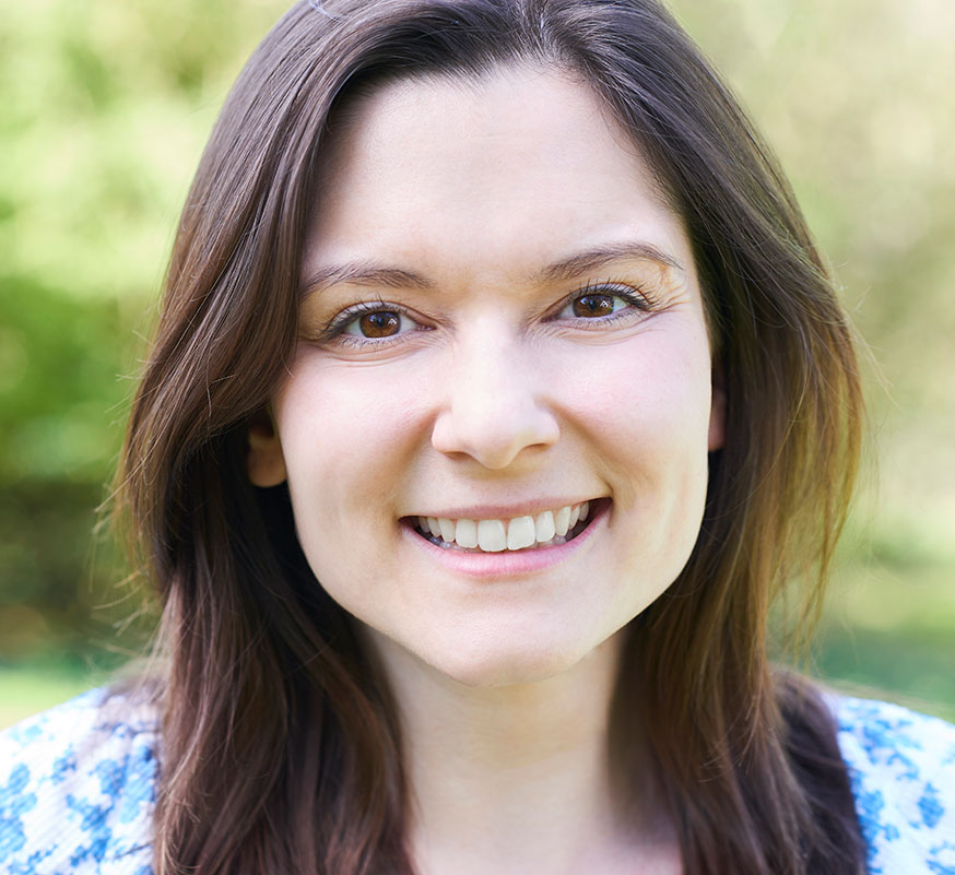 smiling woman with no visible fillings